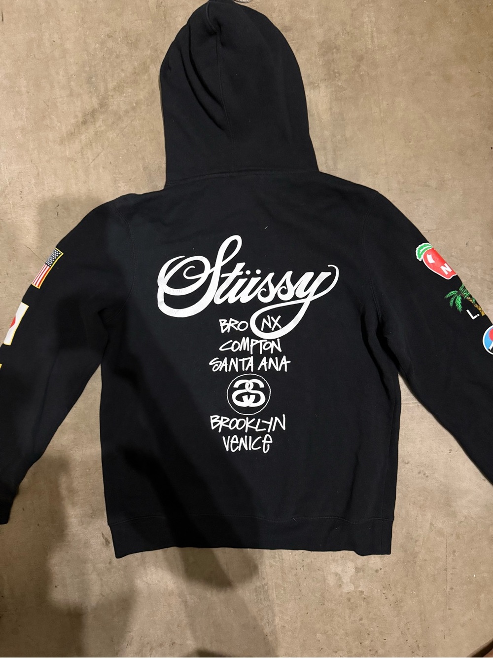 Stussy world tour Black Hoodie with Multicolor Sleeve Patches